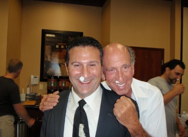 Two Cranial Facial Release doctors smiling with the CFR balloon instruments in place at a seminar