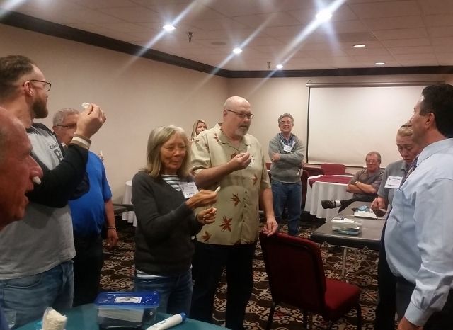 Dr. Adam Del Torto demonstrating the Cranial Facial Release technique to doctors at a seminar
