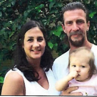Tami Flor with her husband and baby